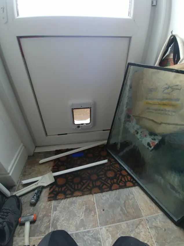 Replacement door panels fitted. For cat flaps.